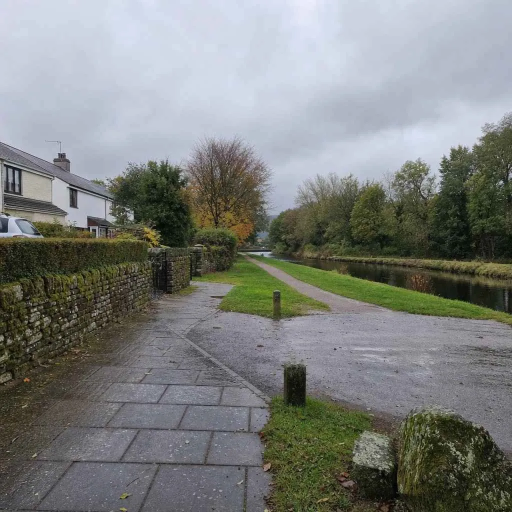 a quiet suburban pavement and canal towpath on a grey day