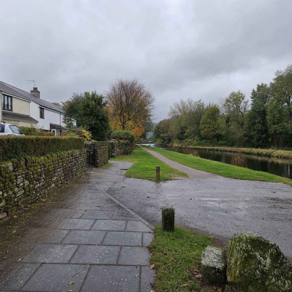 a quiet suburban pavement and canal towpath on a grey day